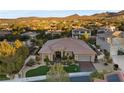 Beautiful aerial shot of an estate-style house with professional desert landscaping at 10 Greely Club Trl, Henderson, NV 89052