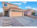 Charming home displaying its neutral color palette, tile roof and attached two-car garage at 1312 Pacific Terrace Dr, Las Vegas, NV 89128