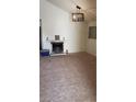 Spacious living room featuring a fireplace, a large window for natural light, and neutral carpet at 2021 San Simeon St, Las Vegas, NV 89108