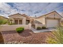 This charming single-story home boasts a terra cotta roof, an attached two car garage and low-maintenance desert landscaping at 2345 Hot Brook Point St, Las Vegas, NV 89134