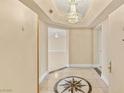 Elegant foyer featuring a decorative tiled floor, chandelier, and neutral color palette at 2857 Paradise Rd # 601, Las Vegas, NV 89109