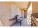 Cozy balcony with a chair and pillows, offering a relaxing outdoor space at 3455 Erva St # 219, Las Vegas, NV 89117