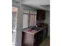 Well-lit kitchen with granite counters, stainless steel appliances, and ample storage at 4304 Gretna Green Ct, Las Vegas, NV 89110