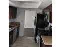 Efficient kitchen with stainless steel appliances, granite countertops, and tile flooring at 4304 Gretna Green Ct, Las Vegas, NV 89110