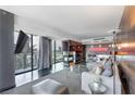 Modern living room with sleek floors, city views, and contemporary furnishings at 4381 West Flamingo Rd # 8322, Las Vegas, NV 89103