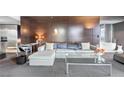 Stylish living room showcasing a comfortable sectional sofa and contemporary glass coffee table at 4381 West Flamingo Rd # 8322, Las Vegas, NV 89103