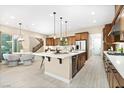 Beautiful kitchen with a center island, modern appliances, and an adjacent dining area with seating at 441 Beautiful Hill Ct, Las Vegas, NV 89138