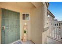 A welcoming front porch with a secure door and decorative 'HOME' sign at 514 Regal Robin Way, North Las Vegas, NV 89084