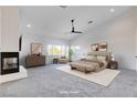 Spacious main bedroom with a fireplace, sitting area, and neutral tones at 5148 Villa Vecchio Ct, Las Vegas, NV 89141