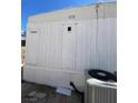 Exterior of home featuring vertical white siding at 5580 E Carey Ave, Las Vegas, NV 89156
