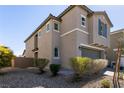 Attractive exterior elevation of a two-story home with a two-car garage and desert landscaping at 6308 Gulf Waters St, North Las Vegas, NV 89081