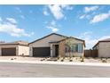 Charming single-story home with a two-car garage and low-maintenance desert landscaping at 6726 N Palmer Estates St, North Las Vegas, NV 89086