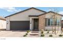 Inviting single-story home with brick accents, desert landscaping, and a two-car garage at 6726 N Palmer Estates St, North Las Vegas, NV 89086