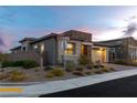 Beautiful single-story home with stone and stucco exterior, nestled in a well-maintained neighborhood at 912 Calluna Hills Ln, Las Vegas, NV 89138