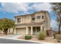 Charming two-story home featuring stucco siding, a tile roof, and a well-manicured front yard at 9432 Victory Garden Ave, Las Vegas, NV 89149