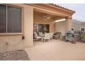 Comfortable covered patio area, perfect for outdoor dining and relaxation with shade and seating at 10401 Sea Palms Ave, Las Vegas, NV 89134