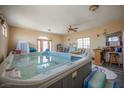 Large indoor hot tub room features a tiled floor and multiple windows for great lighting at 1259 N Hollywood Blvd, Las Vegas, NV 89110