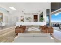 Bright living room with comfortable seating, marble floors, and stylish decor accents at 1484 Macdonald Ranch Dr, Henderson, NV 89012