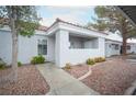 Charming condo with a tiled roof, covered entryway, and low-maintenance desert landscaping at 1704 N Jones Blvd, Las Vegas, NV 89108
