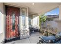 Covered front porch area with seating and a decorative security door at 2804 Gallant Hills Dr, Las Vegas, NV 89135