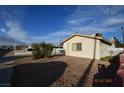 Cozy home featuring desert landscaping and a bright, sunny sky at 301 Falcon Ln, Las Vegas, NV 89107