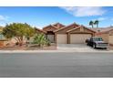 Charming single-story home with a well-maintained yard, desert landscaping, and a two-car garage at 3723 Robin Knot Ct, North Las Vegas, NV 89084