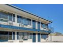 Exterior view of building showing blue railing, window boxes and neutral paint at 4600 University Center Dr # 99, Las Vegas, NV 89119