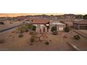 Stunning aerial view of a Southwestern-style home, showcasing the tile roof and desert landscape at 519 N Racetrack Rd, Henderson, NV 89015