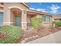 Inviting front entrance featuring a quaint porch and neat landscaping at 5438 Cholla Cactus Ave, Las Vegas, NV 89141