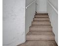 Carpeted staircase leading to the upper level at 5537 Parlay Way # 101, Las Vegas, NV 89122