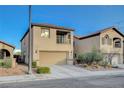 Charming two-story home featuring a two-car garage, a small balcony, and low-maintenance landscaping at 6828 Sumatra St, Las Vegas, NV 89166