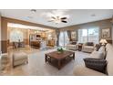 Bright living room and kitchen featuring an open floor plan and neutral color palette at 6828 Sumatra St, Las Vegas, NV 89166