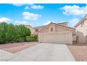 Charming home with a two-car garage, neutral paint, and well-manicured shrubs at 943 Sedona Rd, Henderson, NV 89014