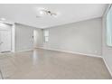 Bright living room featuring neutral walls, tiled floors, and natural light at 10574 Siesta Key St, Las Vegas, NV 89141