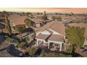 Aerial view of a home with a covered patio and tiled roof in a residential neighborhood at 10971 Civiletti St, Las Vegas, NV 89141