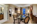 Elegant living room features a dining table, comfortable seating, and stunning city views at 125 E Harmon Ave # 3406 & 3408, Las Vegas, NV 89109