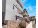 Stylish townhome exterior with a private entrance and modern architectural details at 2509 Silent View Ave, Henderson, NV 89044