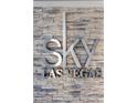 Close up of the 'SKY Las Vegas' sign on a stone wall, showcasing the building's modern design at 2700 Las Vegas Blvd # 1202, Las Vegas, NV 89109