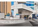 Elegant entrance of SKY Las Vegas featuring lush landscaping and modern architectural details at 2700 Las Vegas Blvd # 1202, Las Vegas, NV 89109
