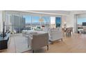 A modern living room with great city views, sleek furniture and wood flooring creates an inviting atmosphere at 2700 Las Vegas Blvd # 1202, Las Vegas, NV 89109
