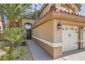 Charming home with a two-car garage, desert landscaping, and a welcoming entrance at 28 Birkdale Dr, Henderson, NV 89074