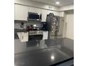 Modern kitchen featuring stainless steel appliances, sleek countertops, and ample cabinet space at 3221 Yolanda Ln, Las Vegas, NV 89121