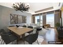 Bright living space with a dining area, comfortable seating, and stunning city views at 3750 Las Vegas Blvd # 2711, Las Vegas, NV 89158