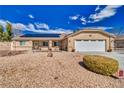 Charming single-story home with desert landscaping, solar panels, and a spacious driveway at 4910 Marywood Ct, Pahrump, NV 89061