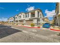 Charming townhomes featuring private garages and cozy balconies against a beautiful sky at 7308 N Decatur Blvd # 1, Las Vegas, NV 89131