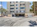 Condo exterior with parking garage and ample parking at 745 N Royal Crest Cir # 158, Las Vegas, NV 89169