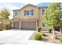 Inviting two-story home featuring a neutral color palette, shutters, attached two-car garage and landscaped front yard at 8084 Bosco Bay Ave, Las Vegas, NV 89113