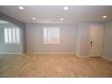 Spacious living room with neutral walls, tiled floors, shuttered windows and plenty of natural light at 8084 Bosco Bay Ave, Las Vegas, NV 89113