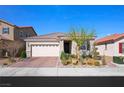 Beautiful single-story home with a paver driveway, desert landscaping, and a two-car garage at 984 Brilliant Meadow Ave, North Las Vegas, NV 89086