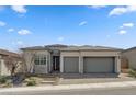 Charming single-story home with a three-car garage, stone accents, and a beautifully landscaped front yard at 10197 Copper Meadow Ave, Las Vegas, NV 89166